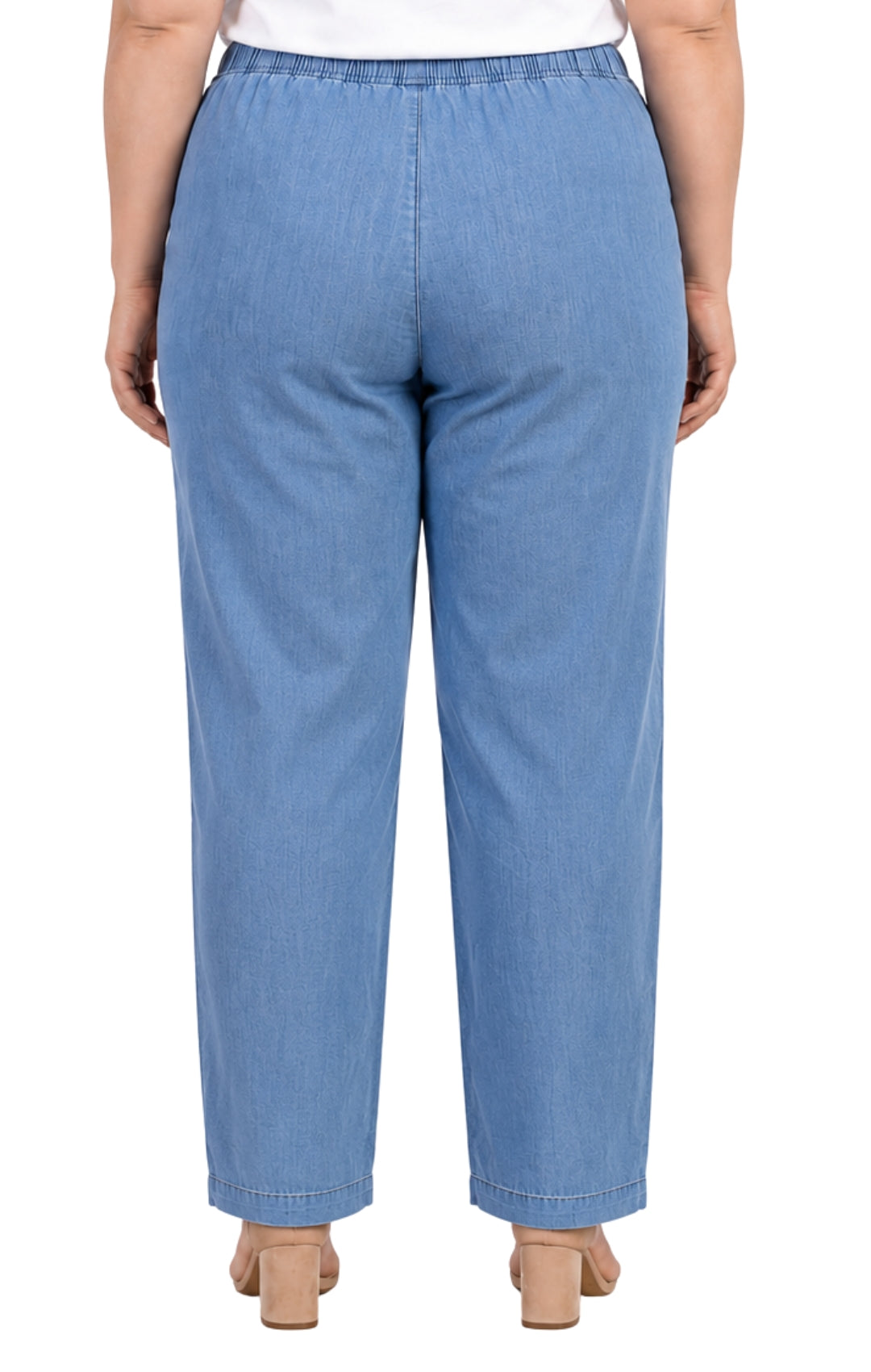 Blue denim pants worn by a person on a white background