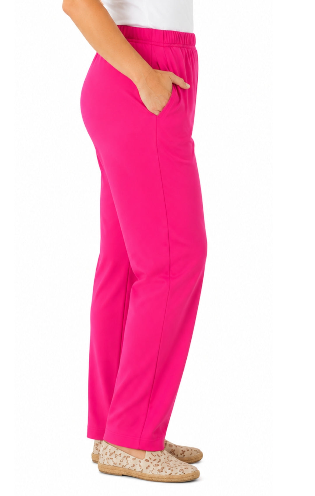 Bright pink pants worn by a person on a white background