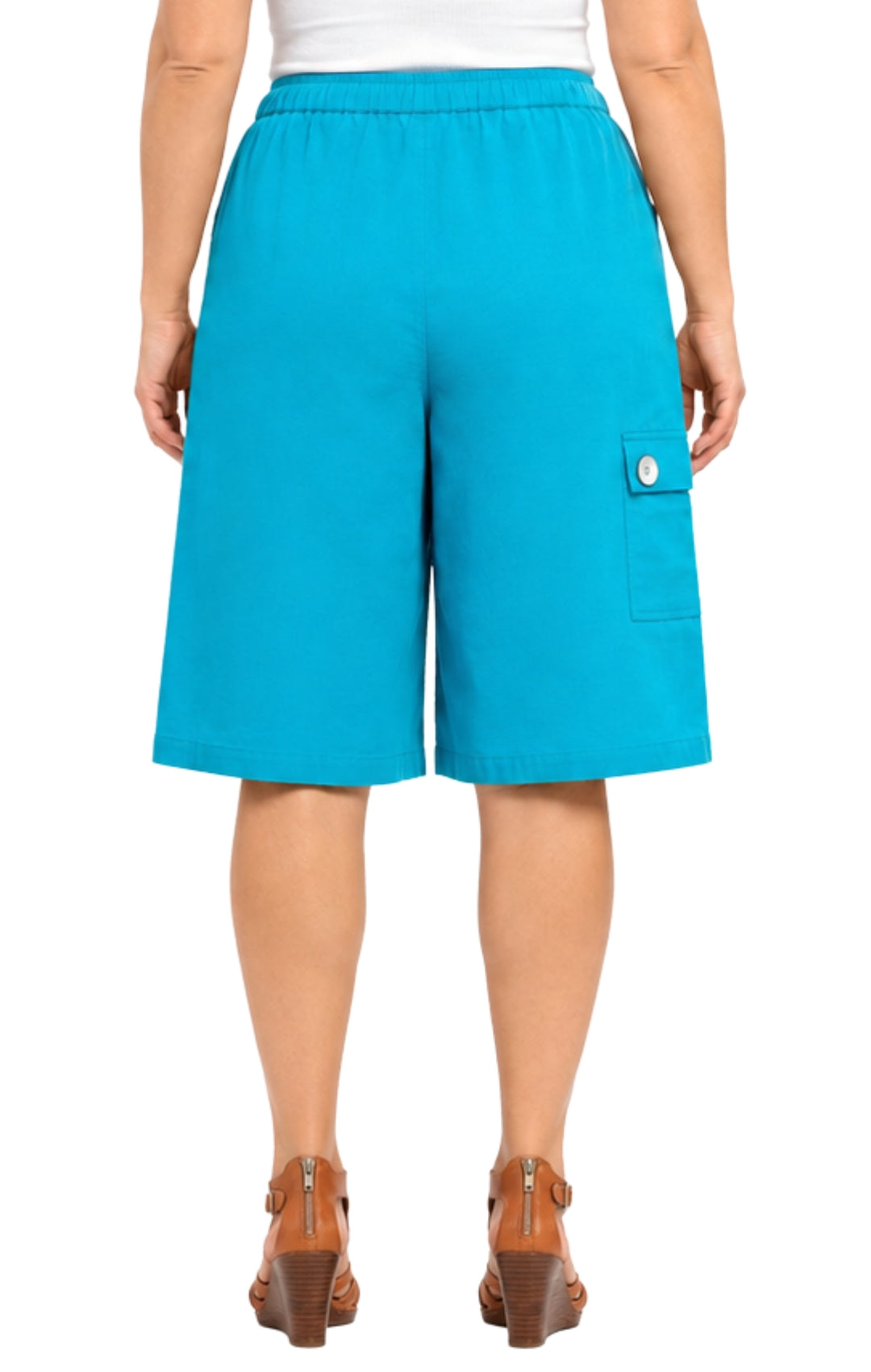 Person wearing bright blue shorts on a white background