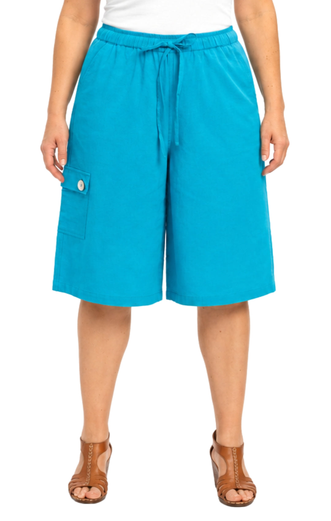 Person wearing bright blue shorts on a white background