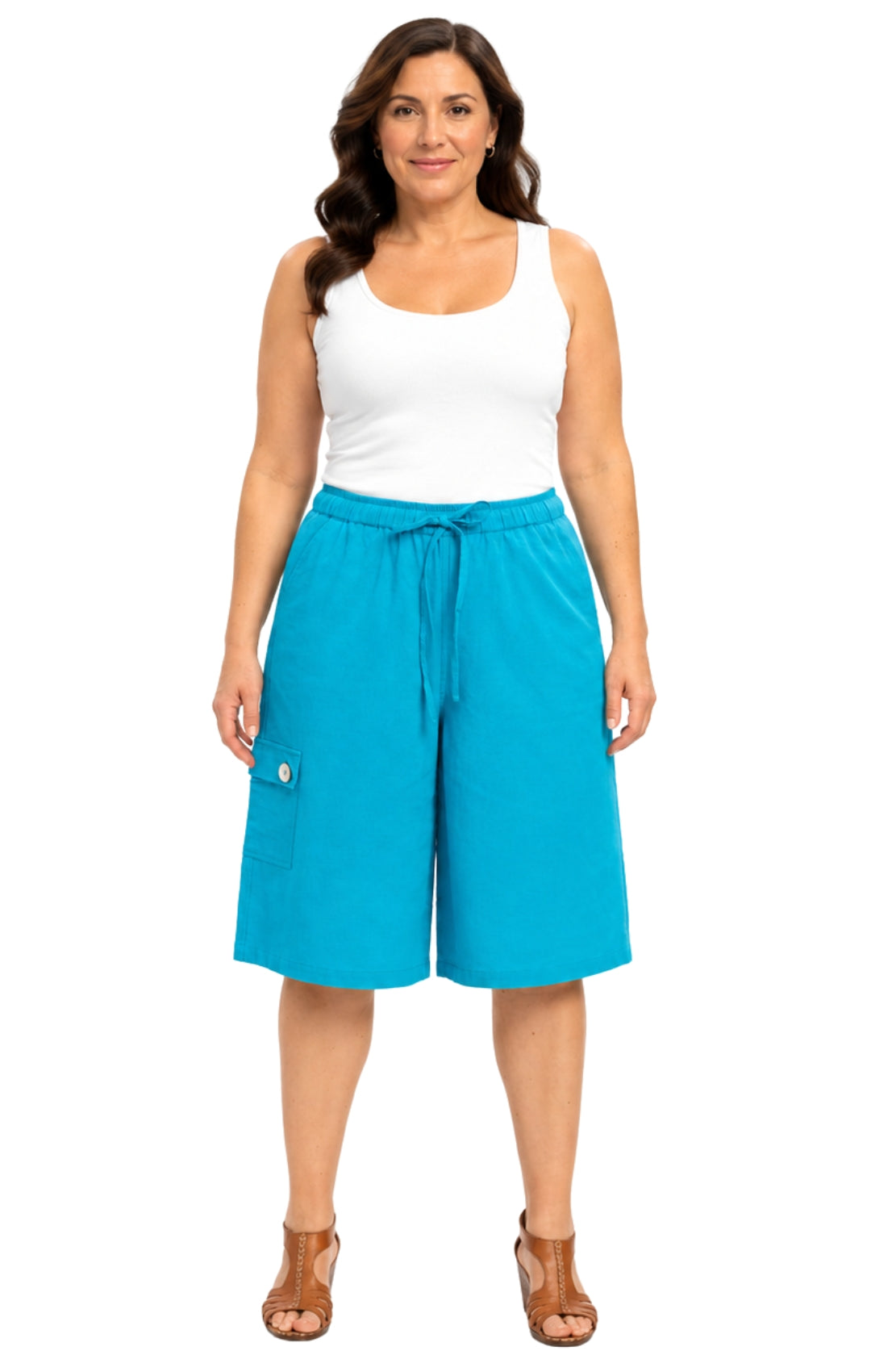 Woman wearing turquoise shorts and a white tank top on a white background