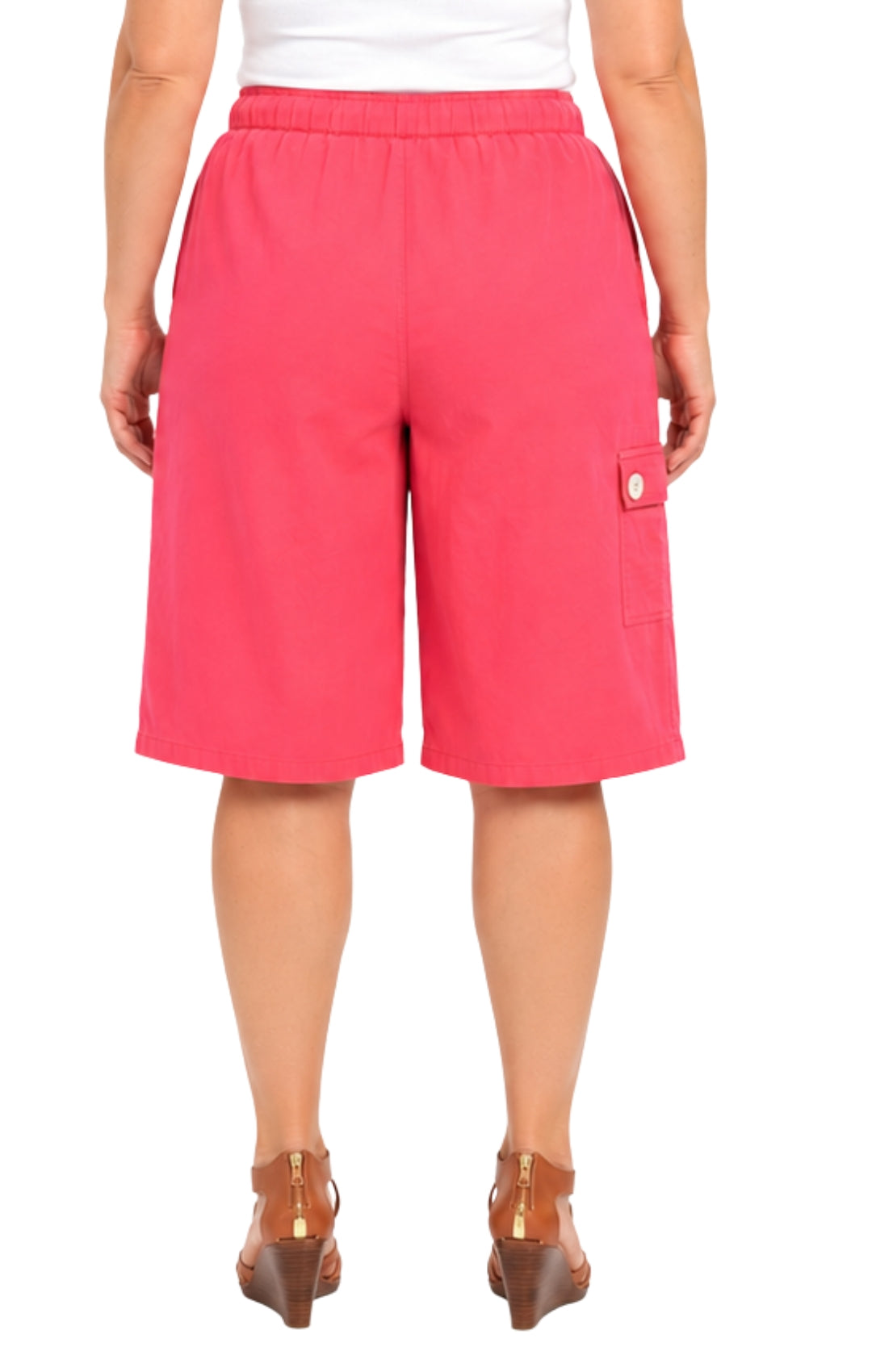Person wearing bright pink shorts on a white background