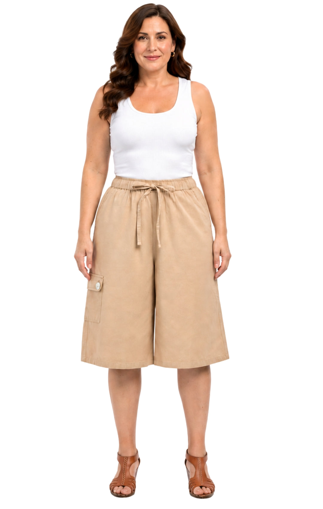 Woman wearing a white tank top and beige skirt on a white background