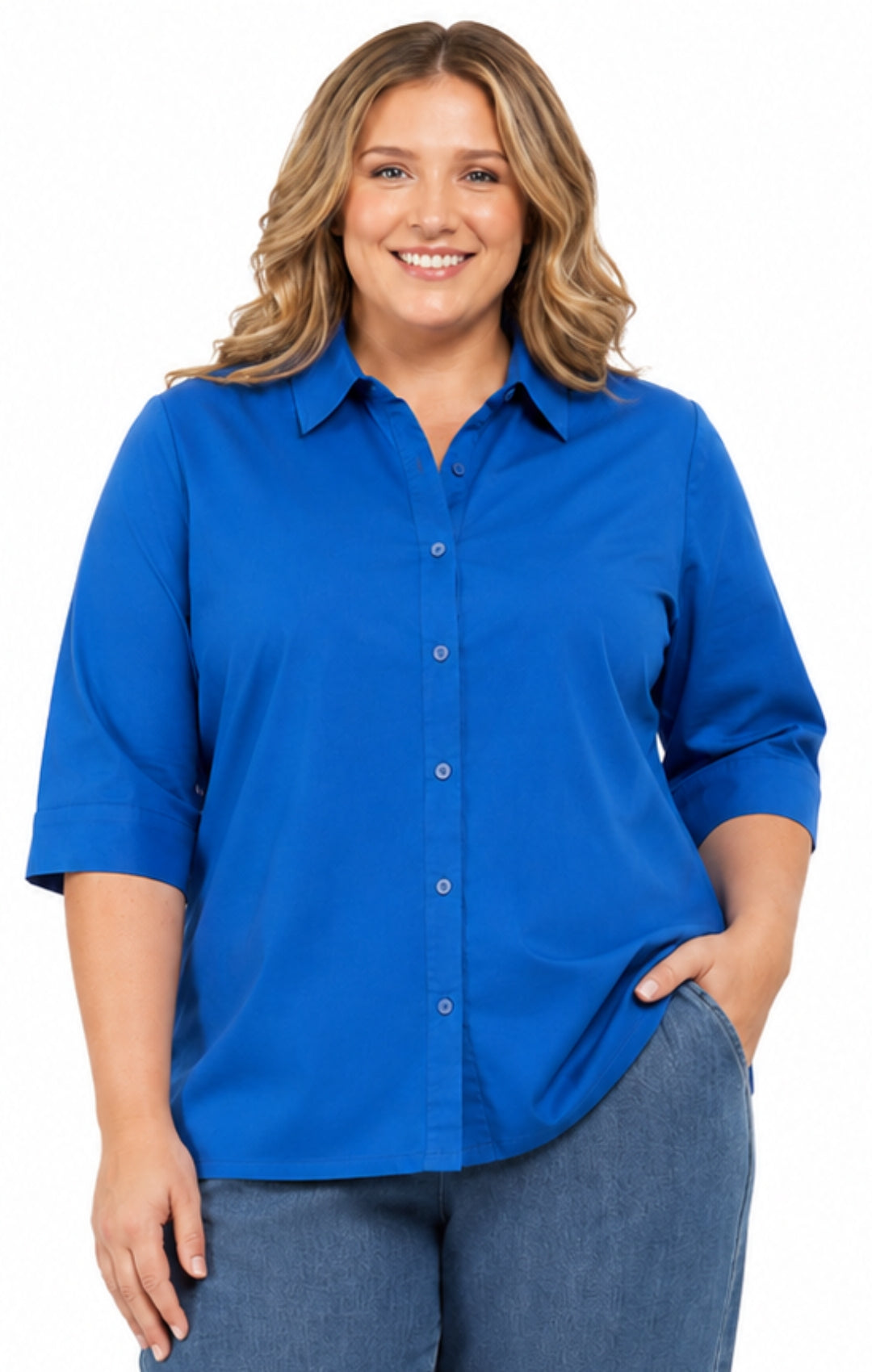 Woman wearing a blue shirt and jeans on a white background