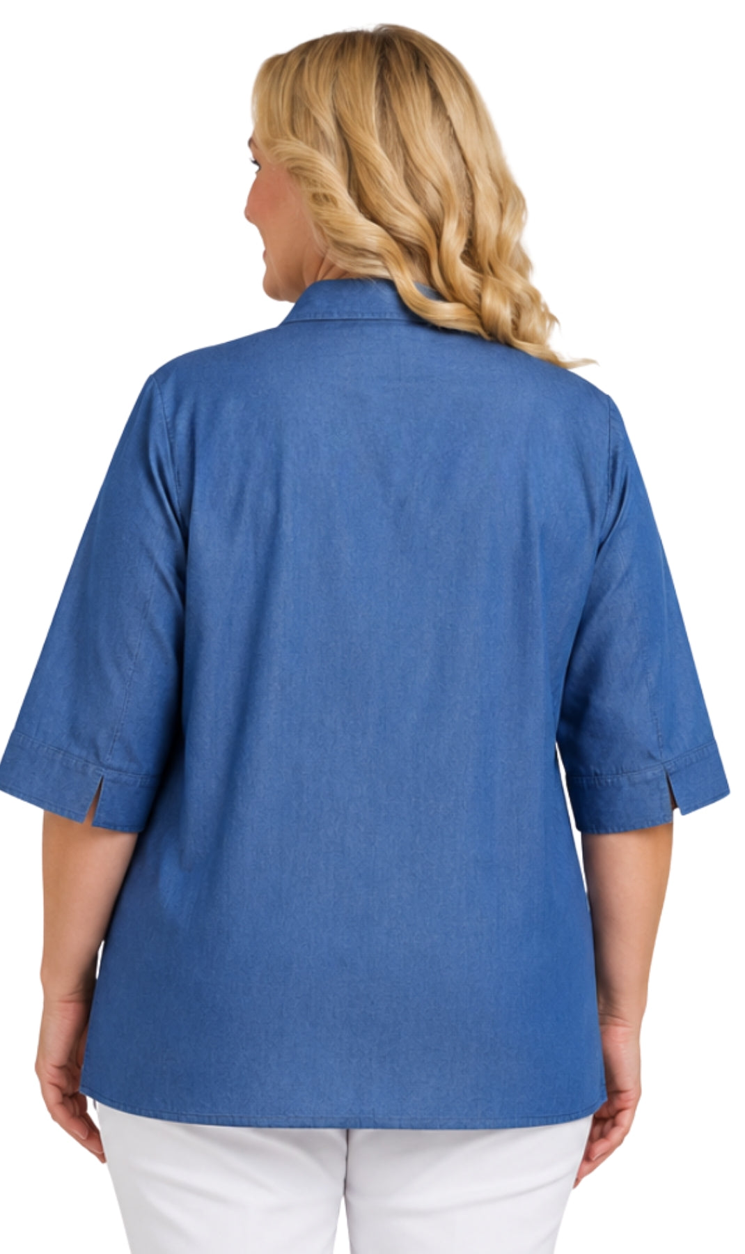 A woman viewed from the back wearing a blue short-sleeve button-up shirt and white pants against a plain white background.