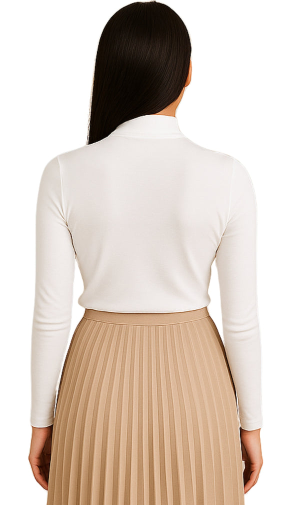 Woman wearing a white long-sleeve top and beige pleated skirt on a white background